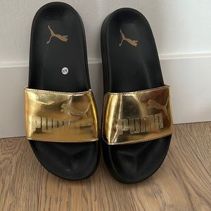 Kids Gold and Black Puma size 5